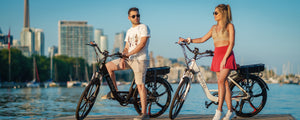Young couple enjoying their electric bikes in Toronto Canada