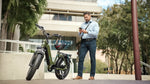 commuter-with-green-magicycle-ocelot-electric-step-thru-fat-tire-e-bike