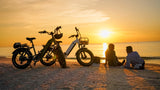 couple-at-sunset-with-magicycle-ocelot-electric-step-thru-fat-tire-e-bikes