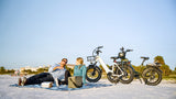 couple-on-beach-with-magicycle-ocelot-pro-electric-step-thru-fat-tire-e-bikes