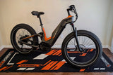 heybike-hero-ebike-front-right-on-orange-launchmat-floor-mat-block-design