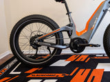 heybike-hero-ebike-rear-quarter-on-orange-launchmat-floor-mat-block-design