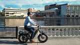 man-commuting-on-magicycle-ocelot-pro-electric-step-thru-fat-tire-e-bike